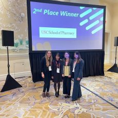 From left to right: Kathryn Perkins (student member), Beverly Fuerte (director of finance), Tiffany Huynh (president), Mia Burgos (president-elect) at AMCP Nexus 2022 in National Harbor, Maryland.