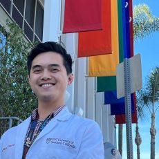 Tam Phan, assistant professor of clinical pharmacy at USC School of Pharmacy, standing in front of the Los Angeles LGBT Center.